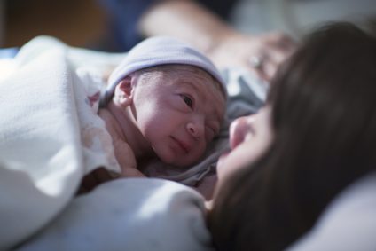 Mom and Newborn In Hospital Bed