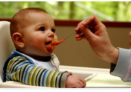 Image of child being fed